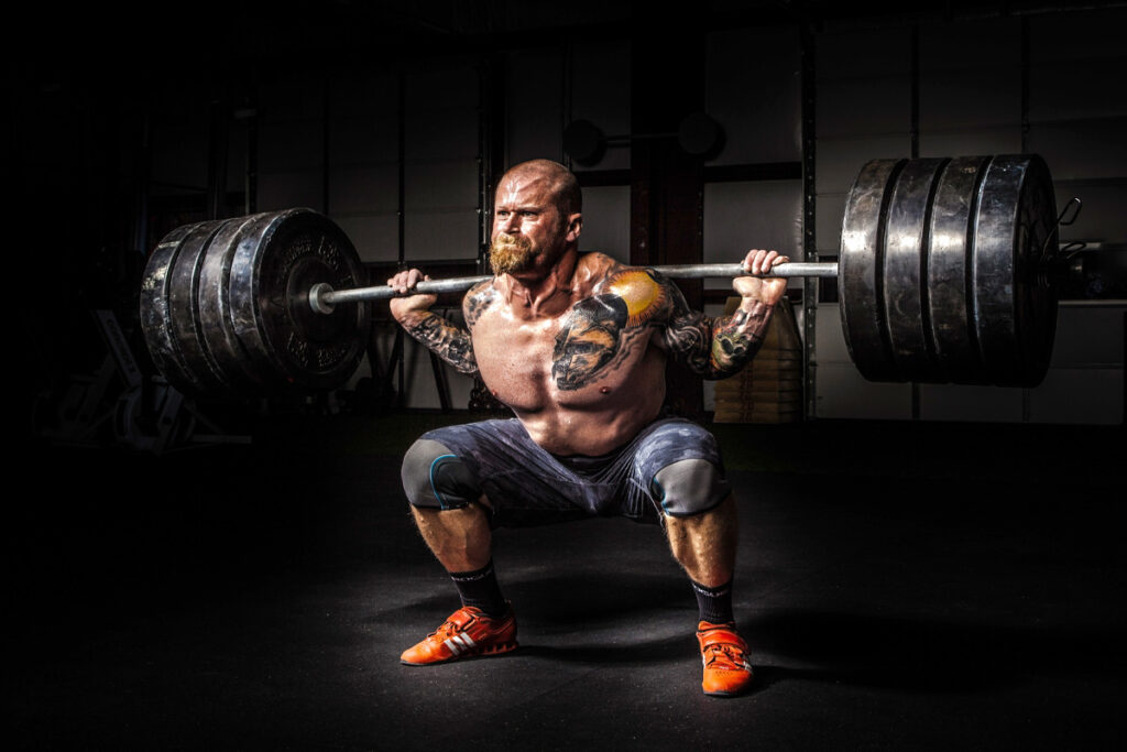 man lifting very heavy weights