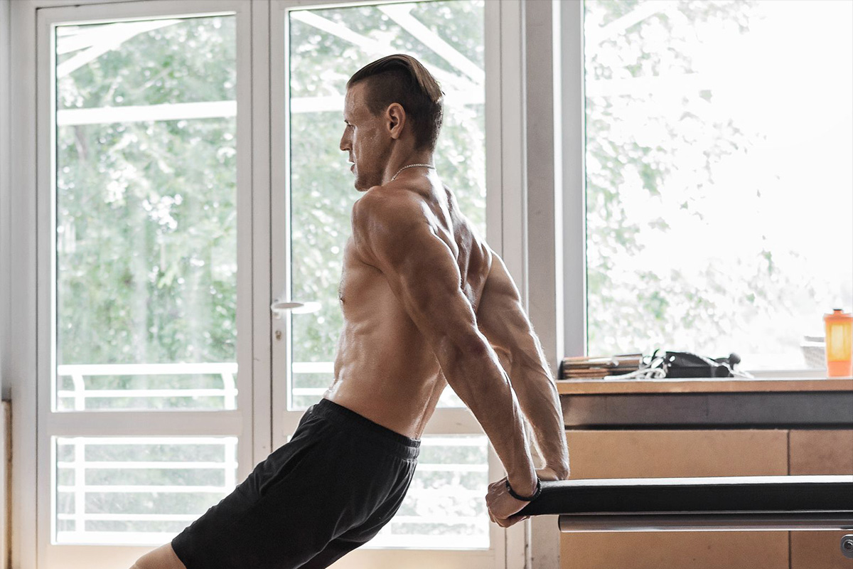 young man working on arms dips exercise